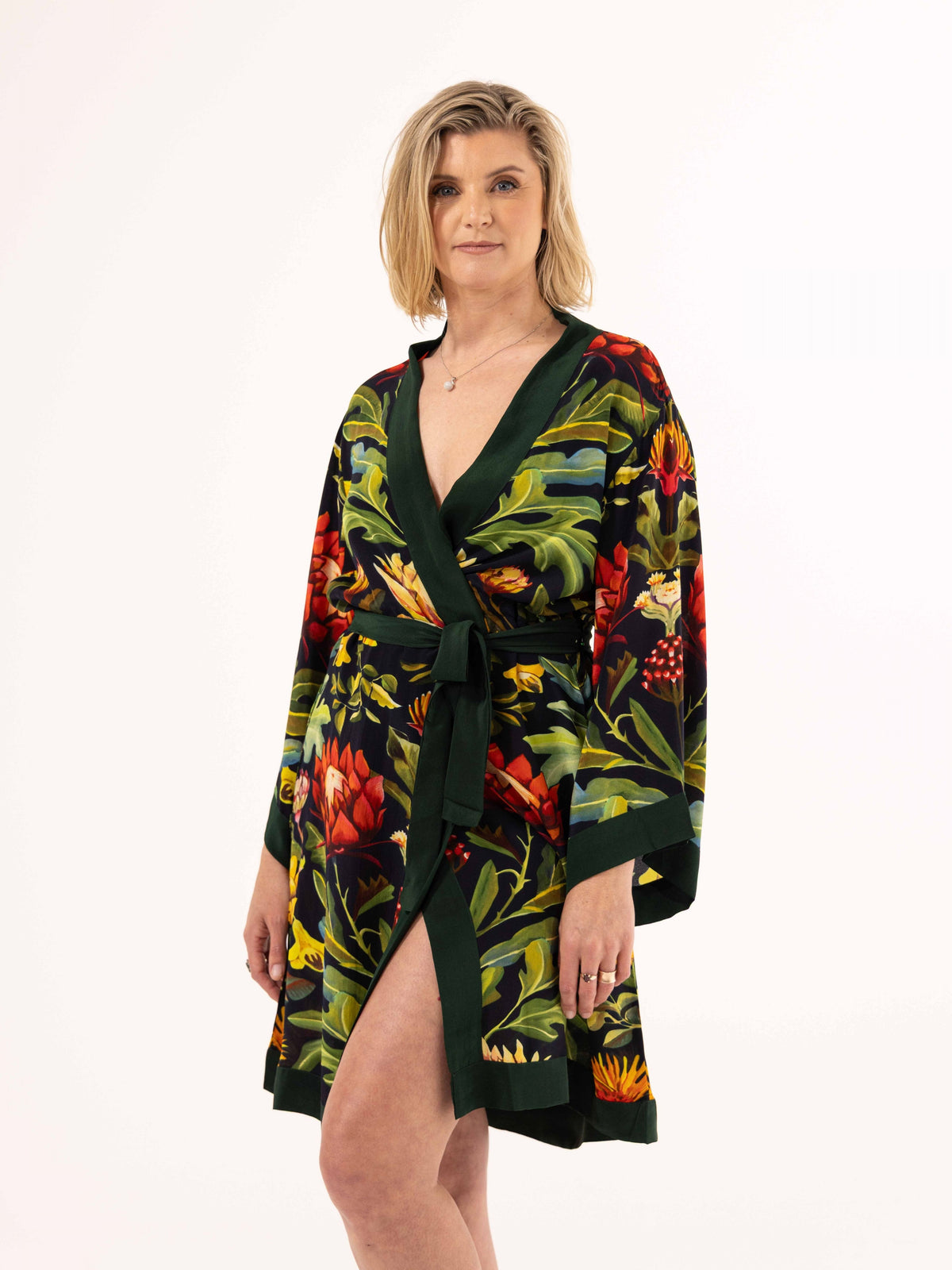ALL•PORT silk robe in Paradisiacal Protea print by Lara Allport – three-quarter view, belted, hand on hip