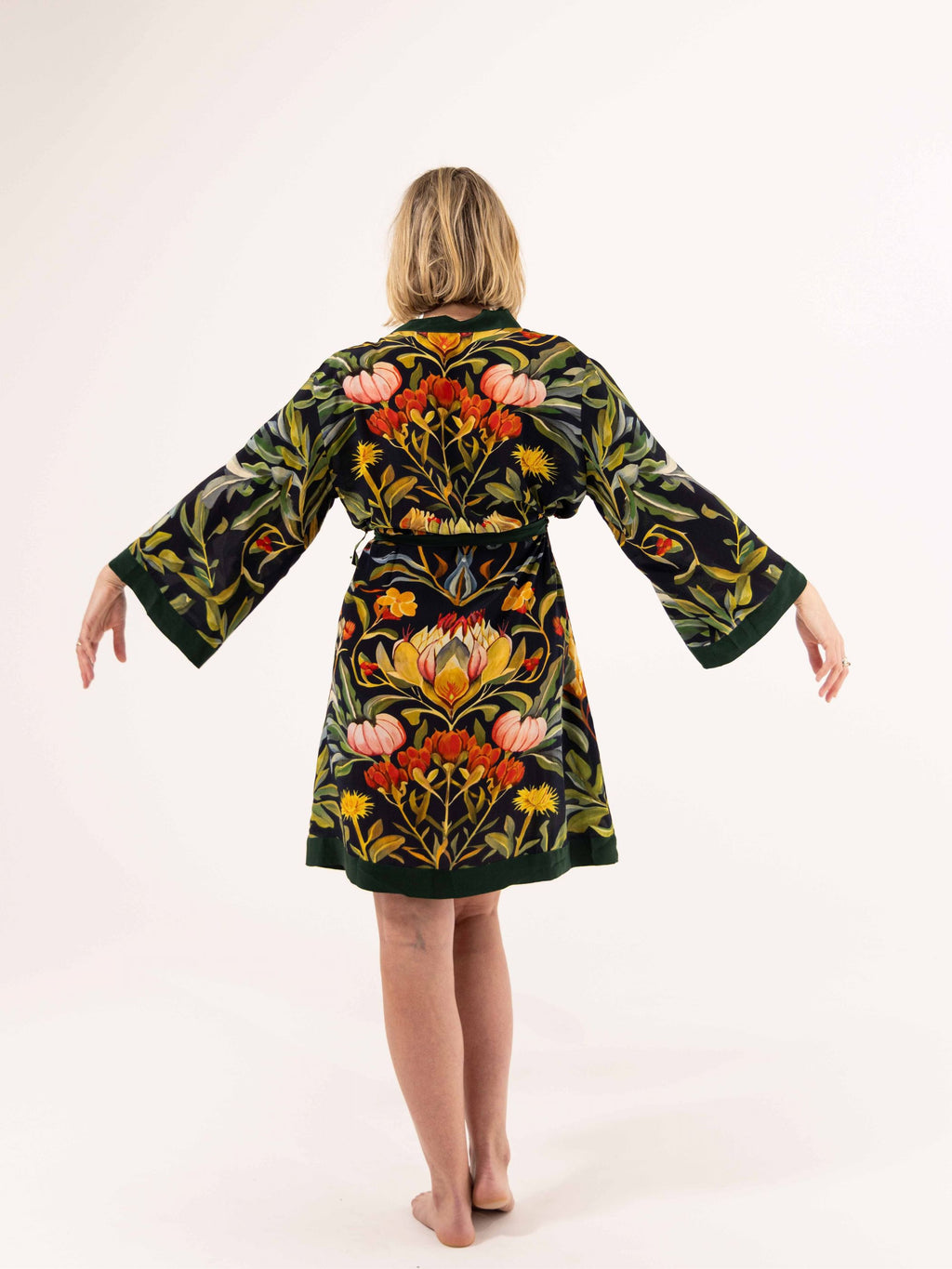 ALL•PORT silk robe in Dandelion Dreams print by Lara Allport – back view with arms outstretched showing kimono sleeves