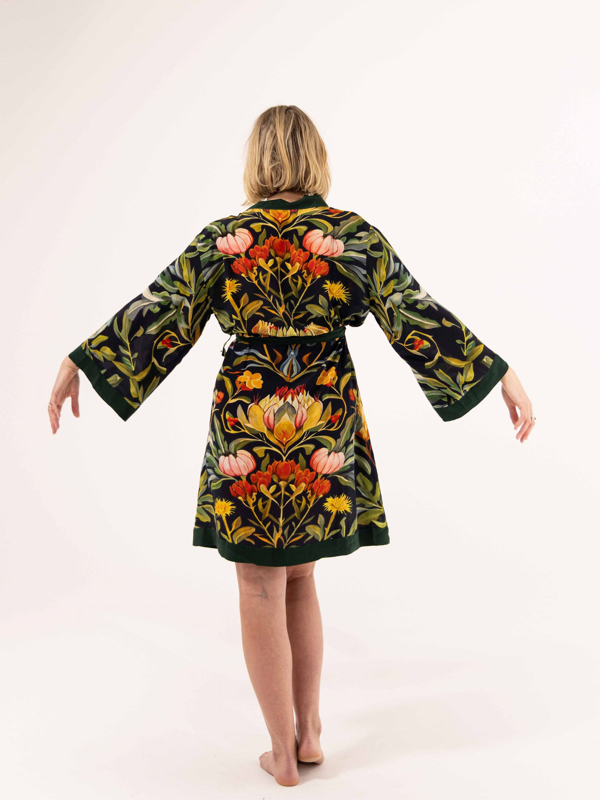 ALL•PORT silk robe in Dandelion Dreams print by Lara Allport – back view with arms outstretched showing kimono sleeves