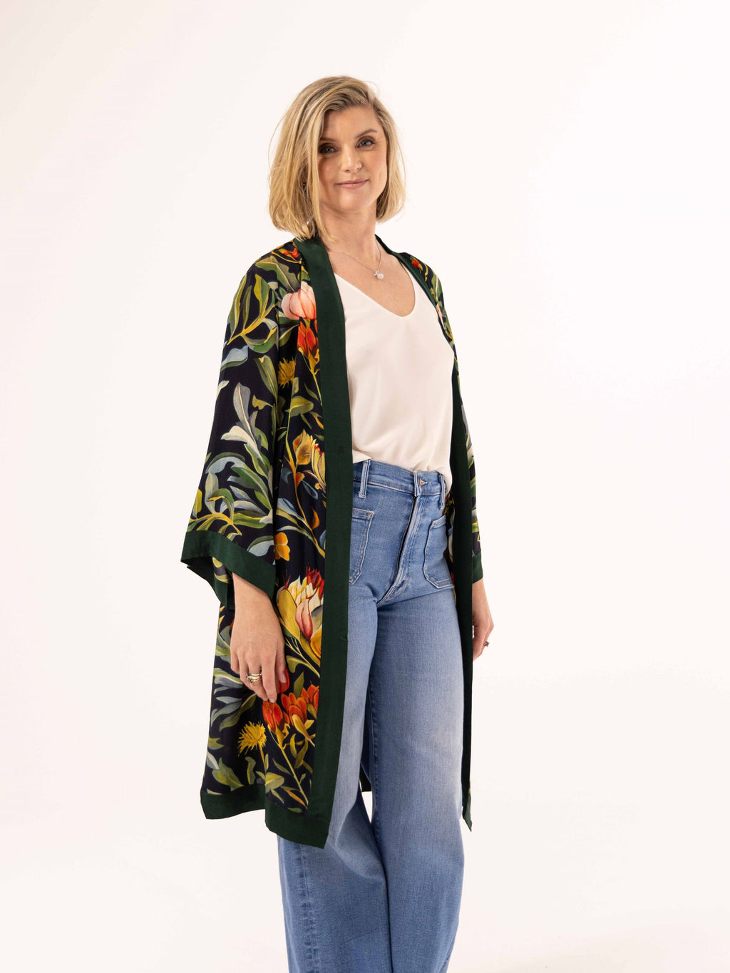 ALL•PORT silk robe in Dandelion Dreams print by Lara Allport – worn open over a white singlet and jeans