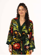ALL•PORT silk robe in Paradisiacal Protea print by Lara Allport – close-up of the front, green border and silk self-tie belt