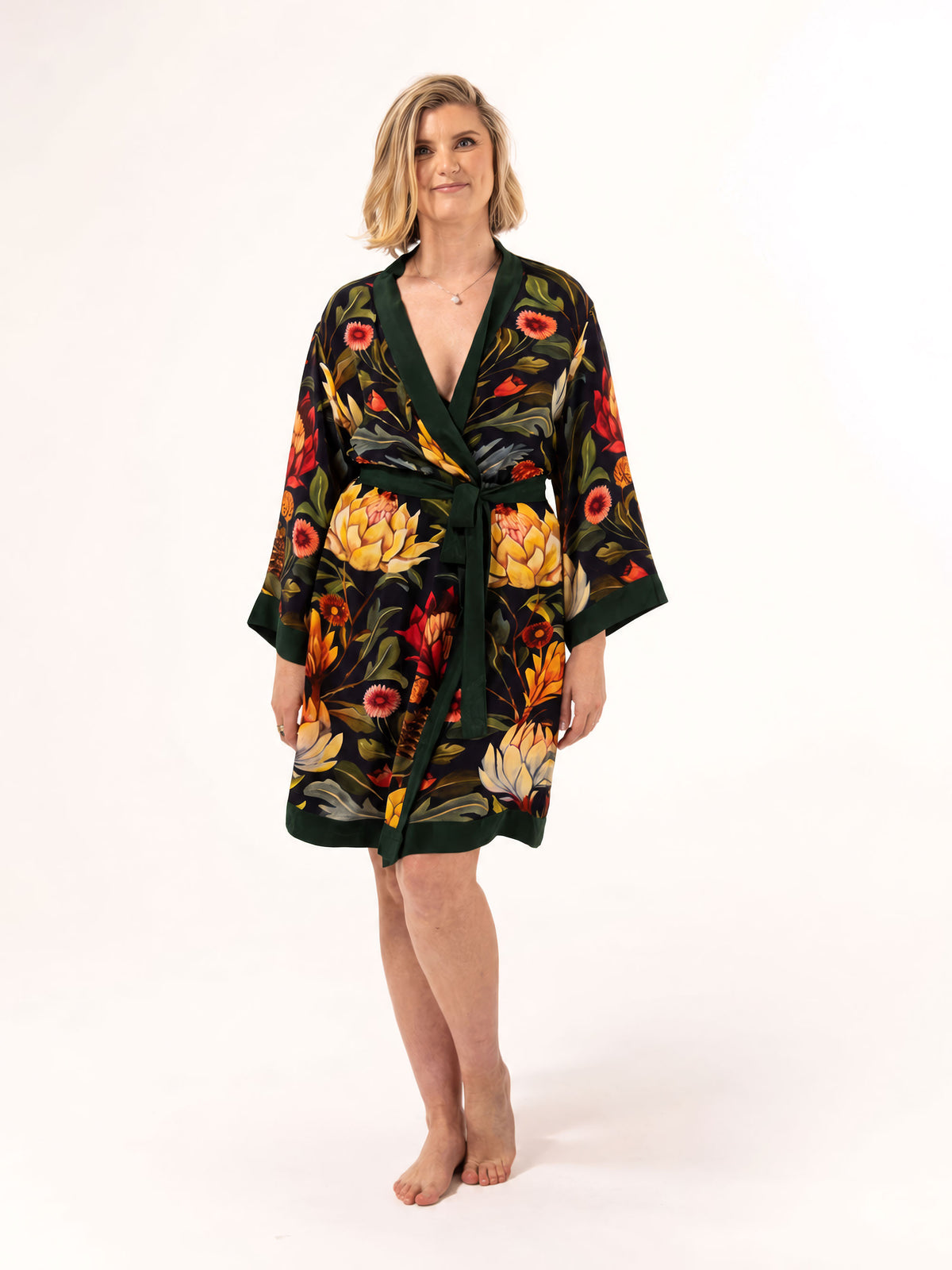 ALL•PORT silk robe in Artichoke Agape print by Lara Allport – front view, tied at the waist, knee length with dark green trim