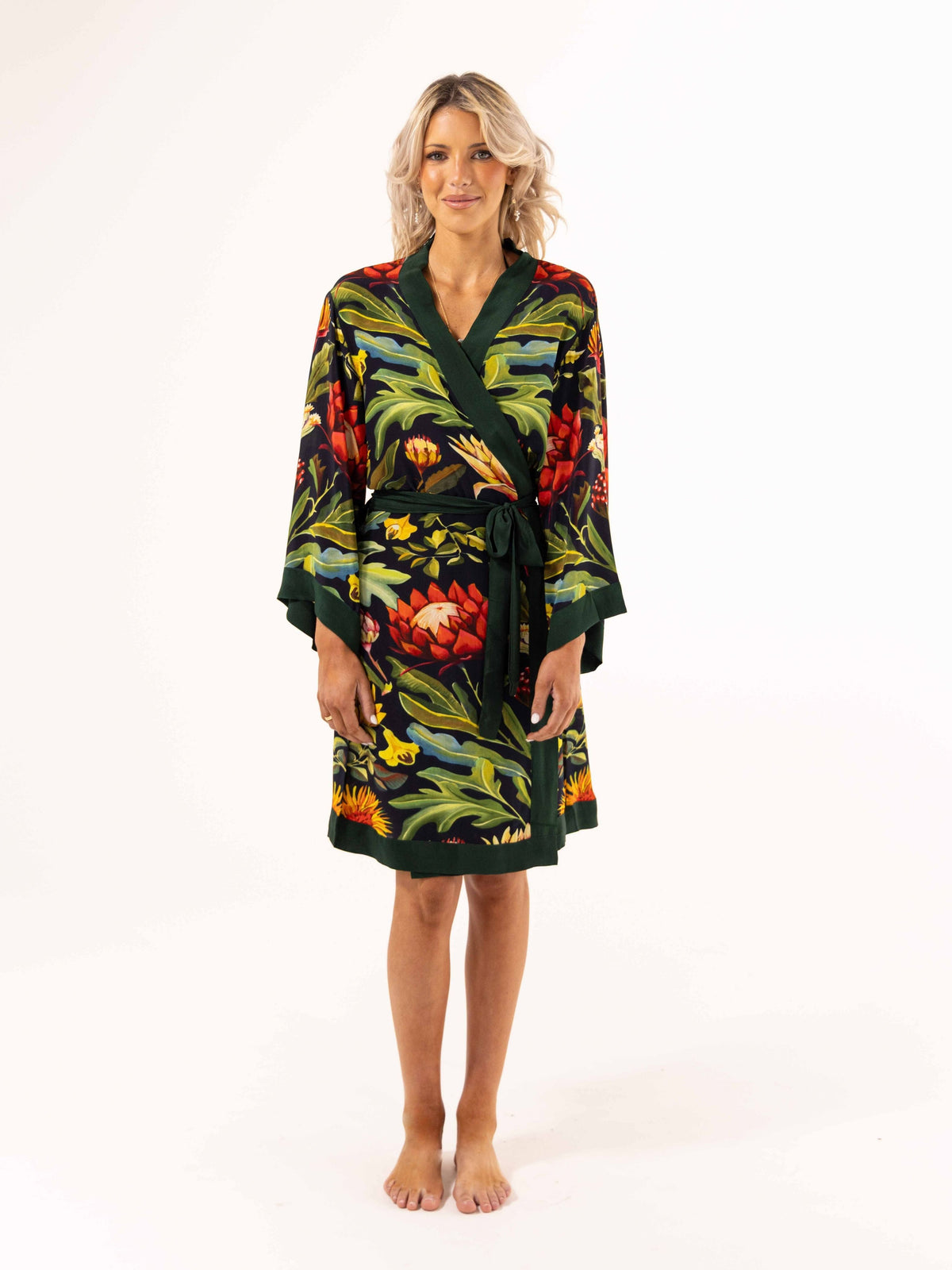 ALL•PORT silk robe in Paradisiacal Protea print by Lara Allport – front view, tied at the waist, knee length with dark green trim